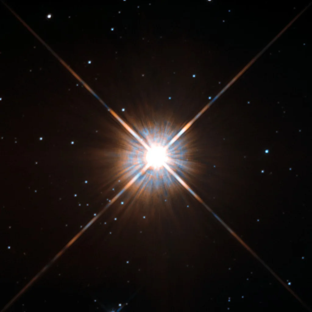 Proxima Centauri — a small red dwarf star with the silhouette of Proxima b crossing its disc.